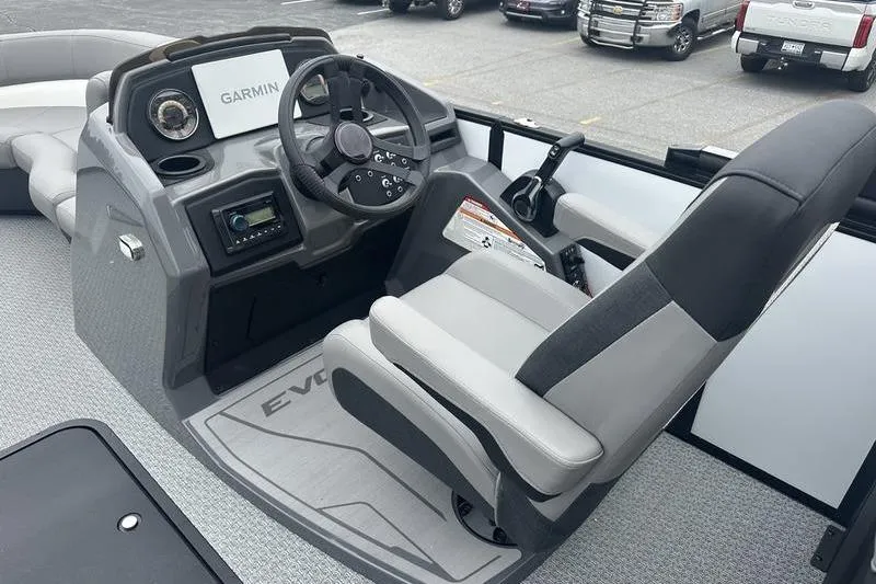 Slide: The Image of Interior of 2026 Evotti 521QL boat with Garmin navigation system and modern controls. - 9