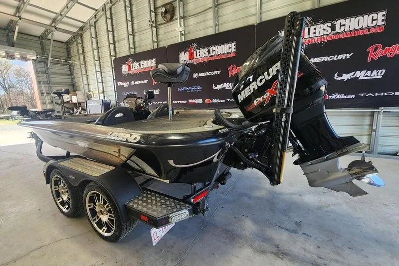 The Image of 2014 Legend 199 Alpha DC boat with Mercury Pro XS engine in a showroom. - 1