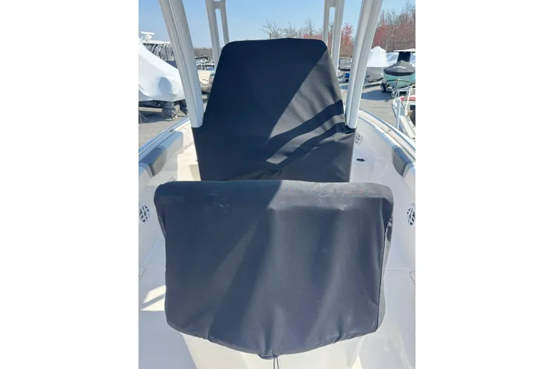 Slide: The Image of 2023 Robalo R222 Center Console boat with covered seating and console. - 3