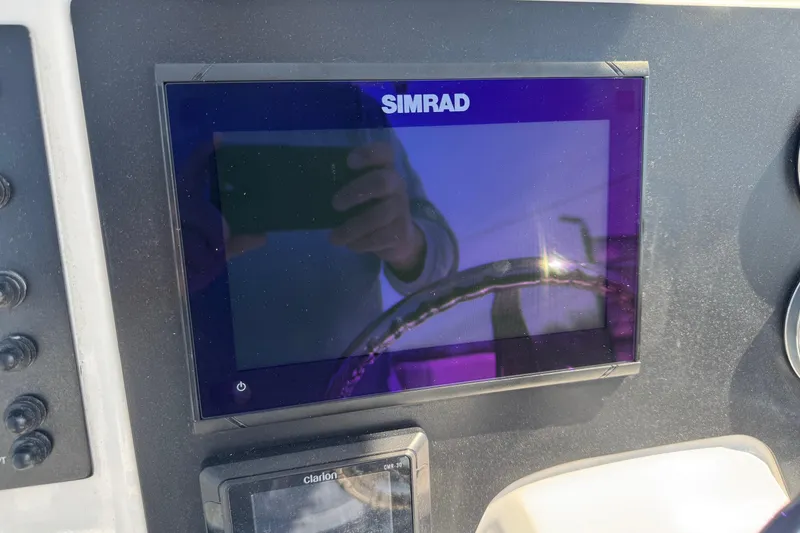 Slide: The Image of Simrad display on 2023 Robalo R222 Center Console boat dashboard. - 4