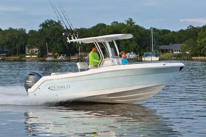 Slide: The Image of Manufacturer Provided Image: 2023 Robalo R222 Center Console boat cruising on a lake with two passengers. - 8