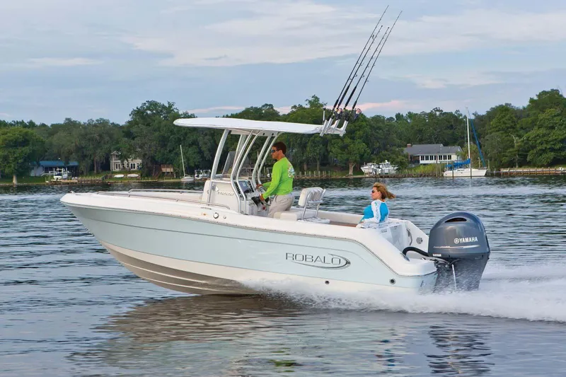 Slide: The Image of Manufacturer Provided Image: 2023 Robalo R222 Center Console boat cruising on a calm lake. - 9