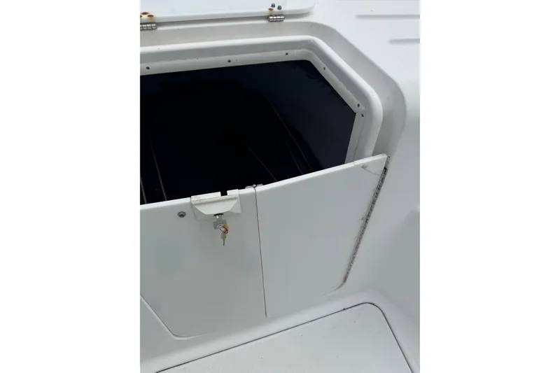 Slide: The Image of Open storage compartment on a 1998 Donzi 30 ZF Daytona boat. - 11