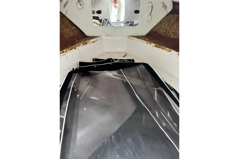 Slide: The Image of Interior view of a 1998 Donzi 30 ZF Daytona boat cabin with clear covers. - 12