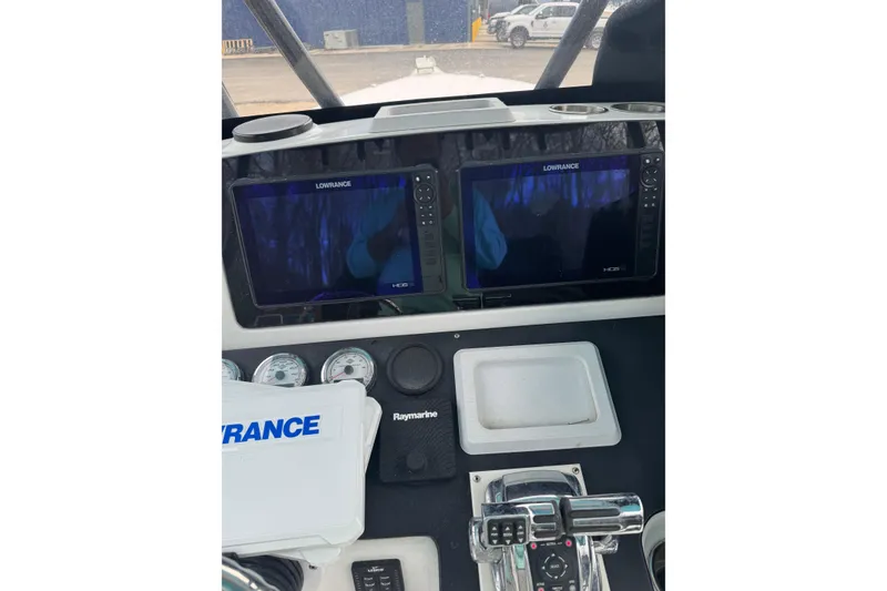 Slide: The Image of Dashboard of a 1998 Donzi 30 ZF Daytona with Lowrance displays and controls. - 17