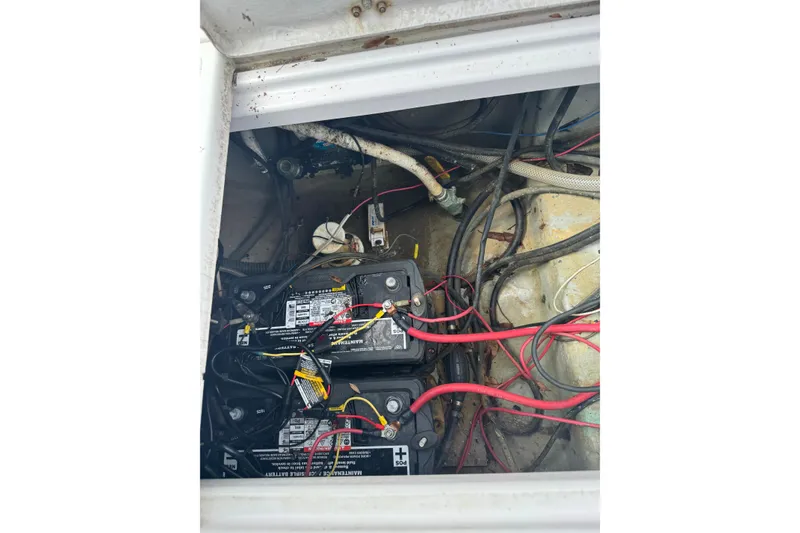 Slide: The Image of Engine compartment of a 1998 Donzi 30 ZF Daytona with visible batteries and wiring. - 20