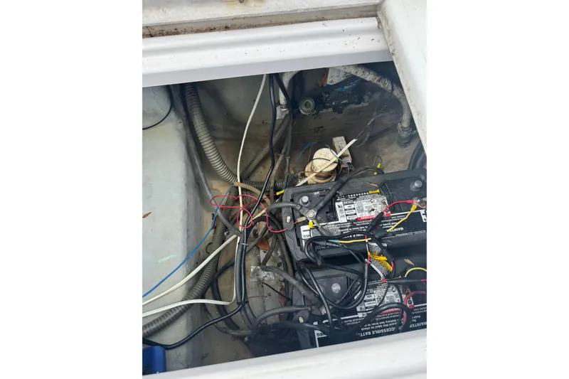 Slide: The Image of Battery compartment of a 1998 Donzi 30 ZF Daytona boat with visible wiring. - 21