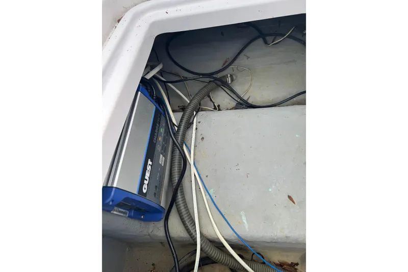 Slide: The Image of Electrical wiring and equipment inside a 1998 Donzi 30 ZF Daytona boat compartment. - 22