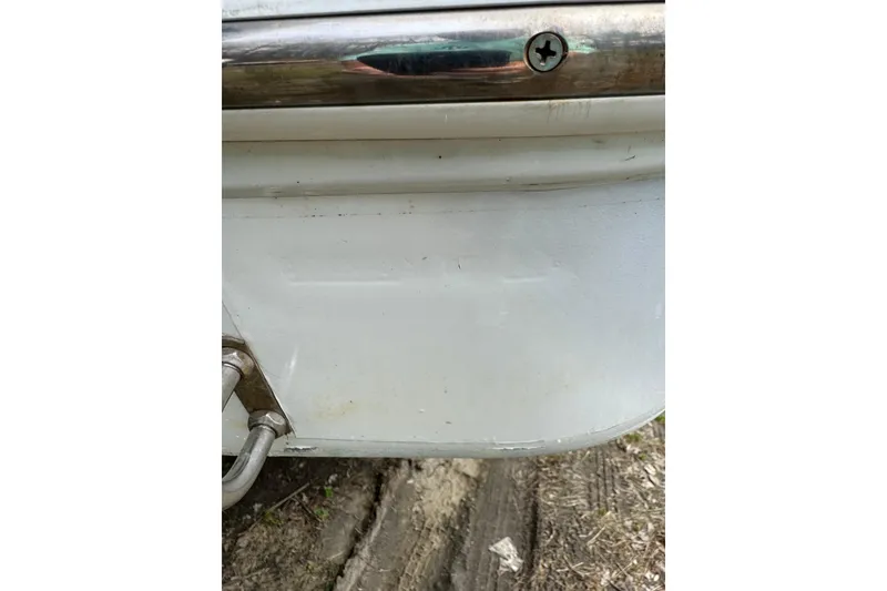 Slide: The Image of Close-up of 1998 Donzi 30 ZF Daytona boat hull with metal fittings. - 5