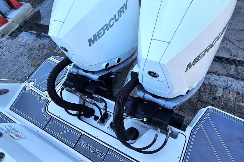 Slide: The Image of Twin Mercury outboard engines on a 2022 Blackfin 272 CC boat. - 13