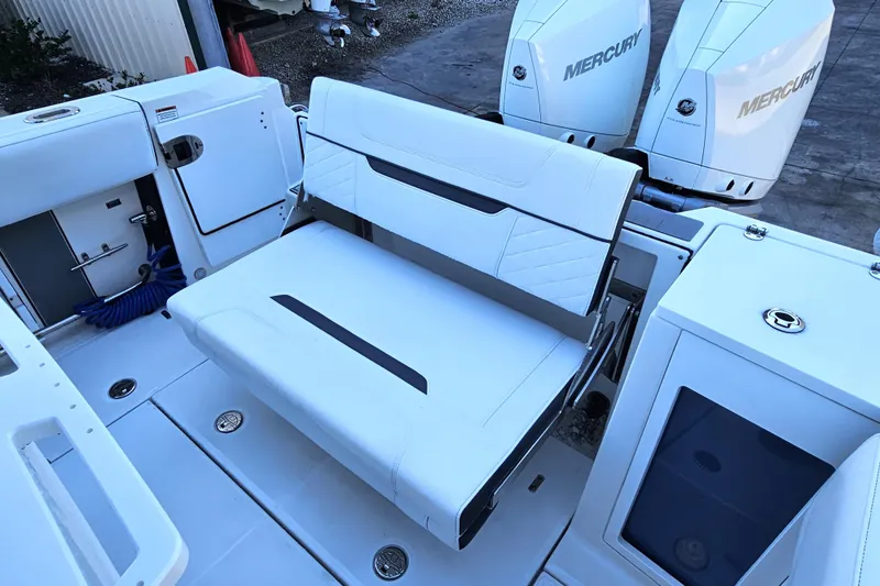 Slide: The Image of 2022 Blackfin 272 CC boat interior with seating and Mercury engines. - 18