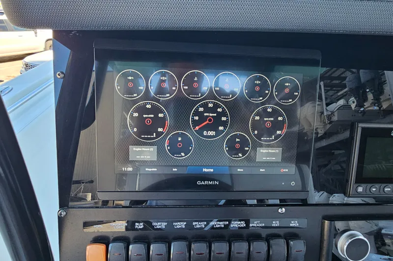 Slide: The Image of Garmin display on 2022 Blackfin 272 CC boat dashboard with various gauges. - 23