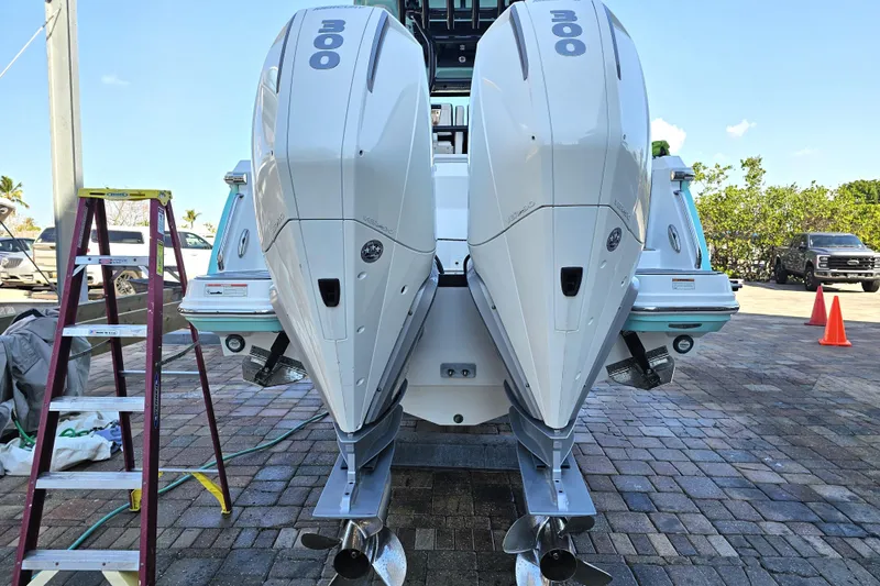 Slide: The Image of 2022 Blackfin 272 CC boat with twin 300 horsepower engines on a sunny day. - 3