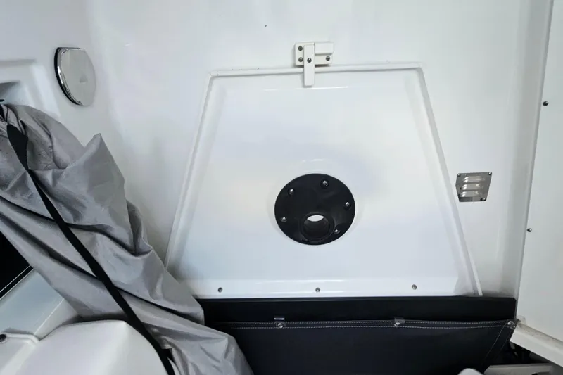 Slide: The Image of Interior view of a 2022 Blackfin 272 CC boat, featuring storage and equipment details. - 32