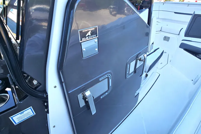 Slide: The Image of 2022 Blackfin 272 CC boat interior with sleek design and secure storage compartments. - 34