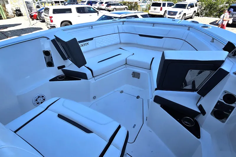 Slide: The Image of 2022 Blackfin 272 CC boat interior with white seating and cup holders. - 36