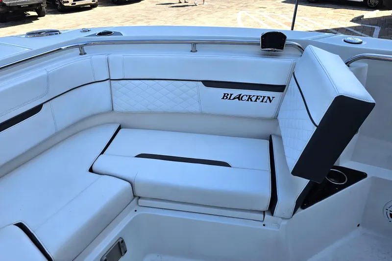 Slide: The Image of Luxurious seating on 2022 Blackfin 272 CC boat with white upholstery and logo. - 38