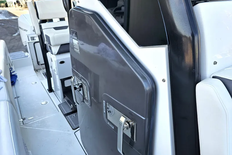 Slide: The Image of 2022 Blackfin 272 CC boat interior with seating and storage compartments. - 47