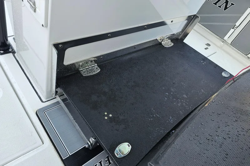 Slide: The Image of 2022 Blackfin 272 CC boat deck with wet surface and hinges. - 48