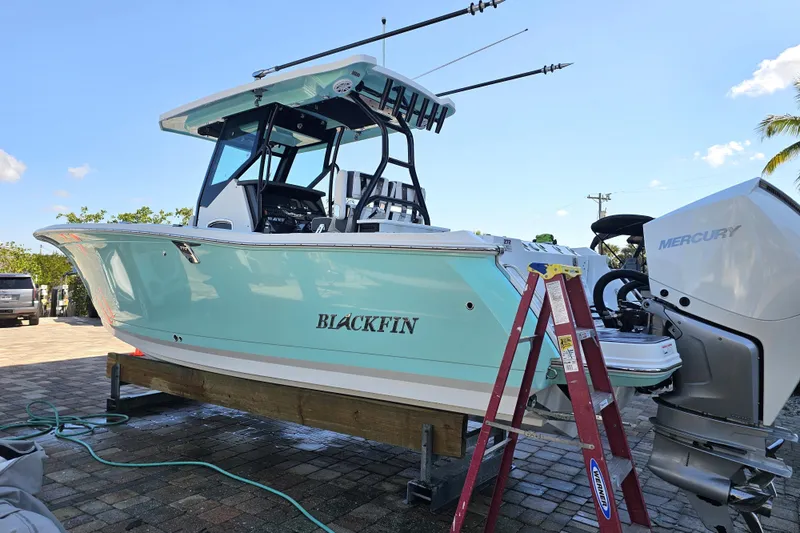 Slide: The Image of 2022 Blackfin 272 CC boat with Mercury engine on a sunny day. - 5