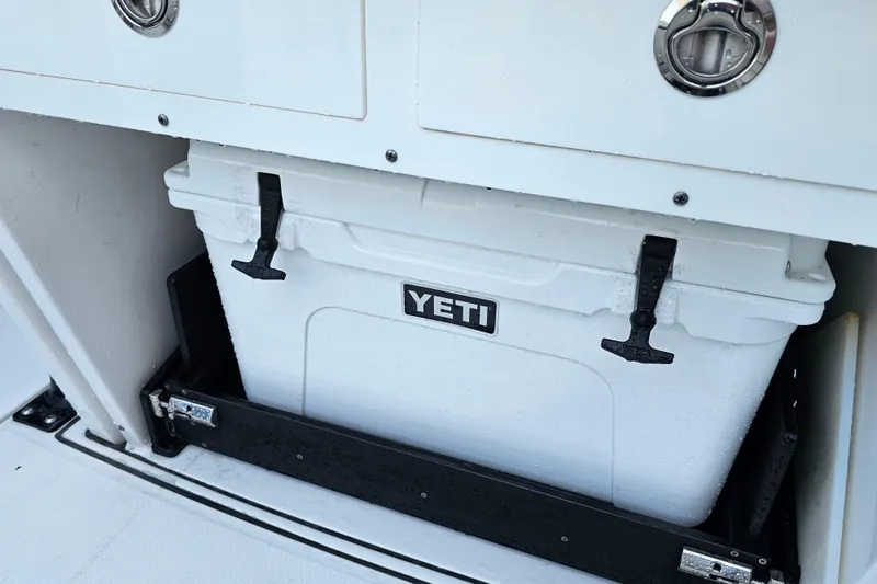 Slide: The Image of YETI cooler stored in a 2022 Blackfin 272 CC boat compartment. - 50