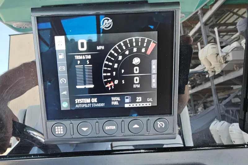 Slide: The Image of Dashboard display of a 2022 Blackfin 272 CC boat showing speed, RPM, and fuel levels. - 52