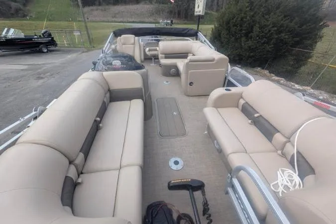 Slide: The Image of 2022 Sun Tracker SportFish 22 XP3 pontoon boat with spacious seating and modern design. - 7