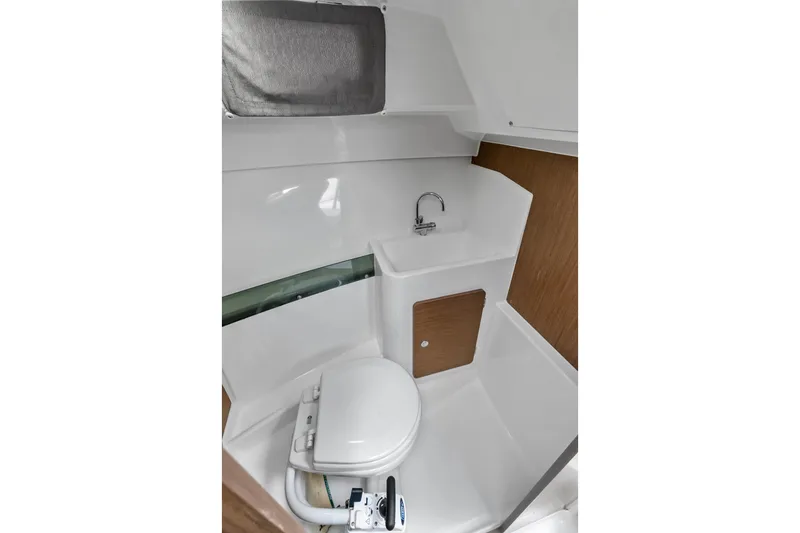 Slide: The Image of Compact bathroom in 2020 Jeanneau NC 795 boat with toilet and sink. - 23