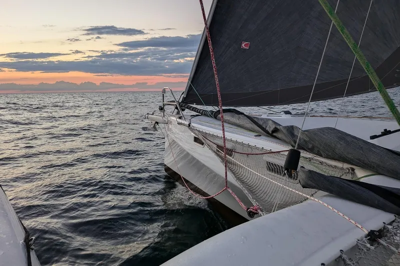 Slide: The Image of 2023 Rapido 40 sailing at sunset on open sea. - 5