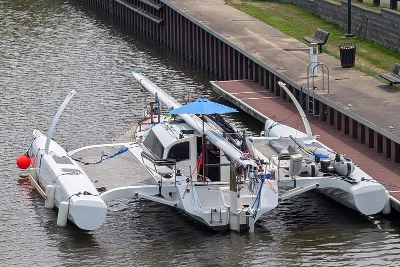 Slide: The Image of 2023 Rapido 40 trimaran docked at a marina, featuring sleek design and modern amenities. - 7