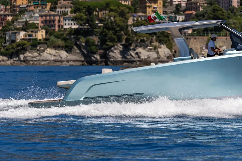 Slide: The Image of 2026 Pardo Yachts P43 cruising on blue waters near scenic coastline. - 2