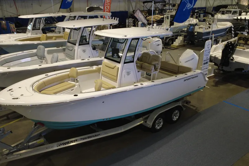 The Image of 2026 Sportsman Heritage 231 Center Console boat displayed indoors on a trailer. - 0