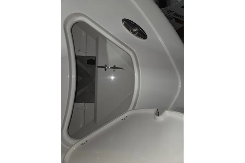 Slide: The Image of 2026 Sportsman Heritage 231 Center Console boat storage compartment detail. - 14