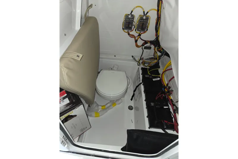 Slide: The Image of 2026 Sportsman Heritage 231 Center Console interior with wiring and marine toilet. - 15
