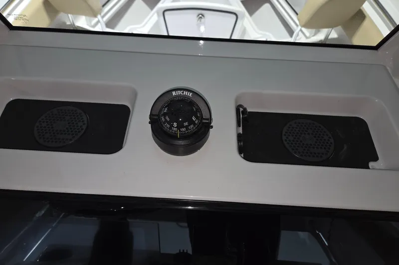 Slide: The Image of Dashboard of 2026 Sportsman Heritage 231 Center Console with compass and speakers. - 16