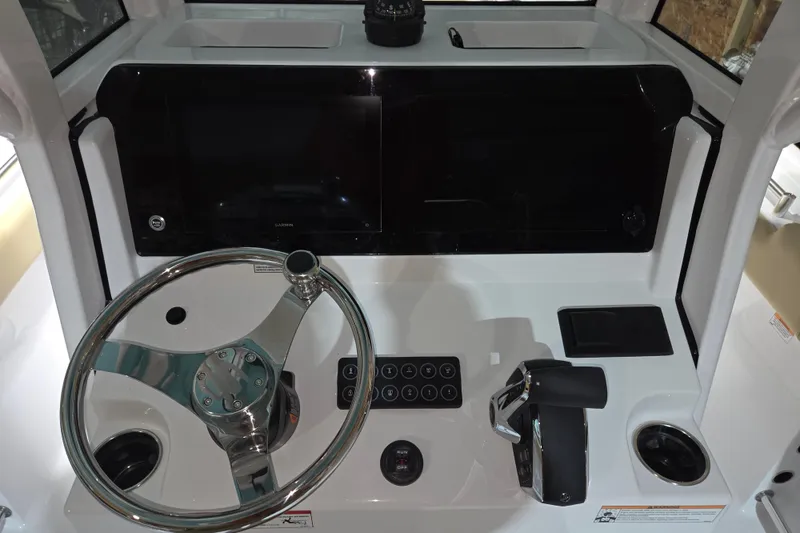 Slide: The Image of 2026 Sportsman Heritage 231 Center Console dashboard with steering wheel and controls. - 19