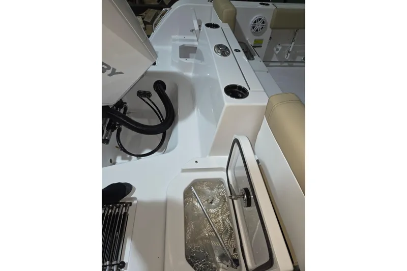 Slide: The Image of 2026 Sportsman Heritage 231 Center Console interior with open storage compartment and seating. - 22