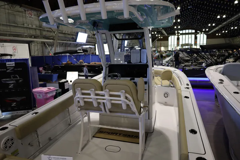 Slide: The Image of 2026 Sportsman Heritage 231 Center Console boat displayed at an indoor exhibition. - 9