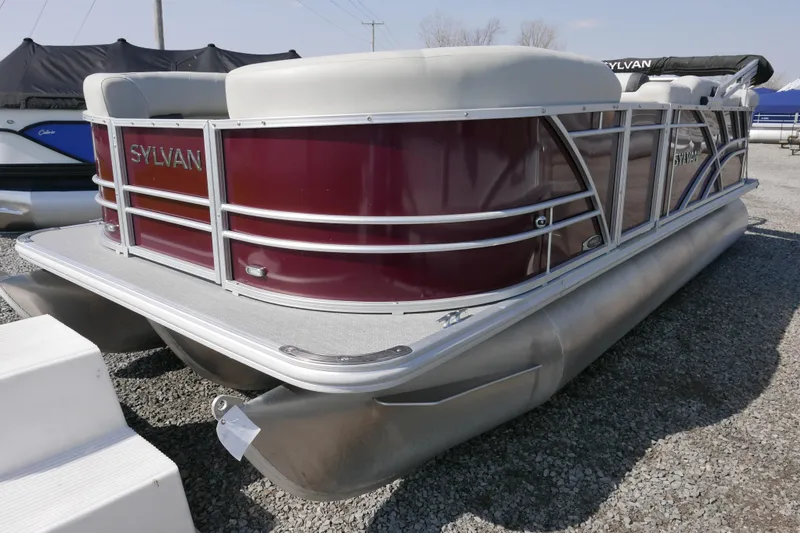 Slide: The Image of 2021 Sylvan Mirage 8520 Cruise pontoon boat with sleek design and maroon exterior. - 2