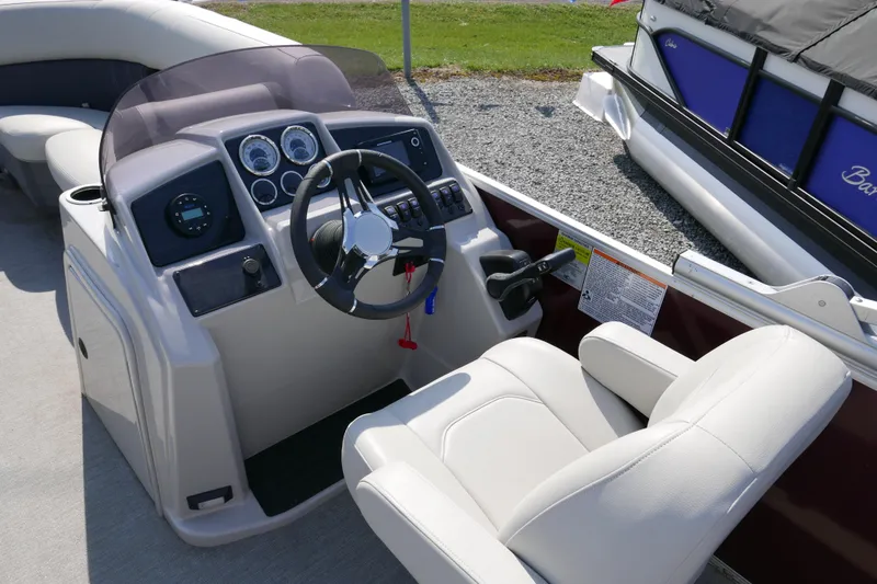 Slide: The Image of 2021 Sylvan Mirage 8520 Cruise boat dashboard with steering wheel and controls. - 6
