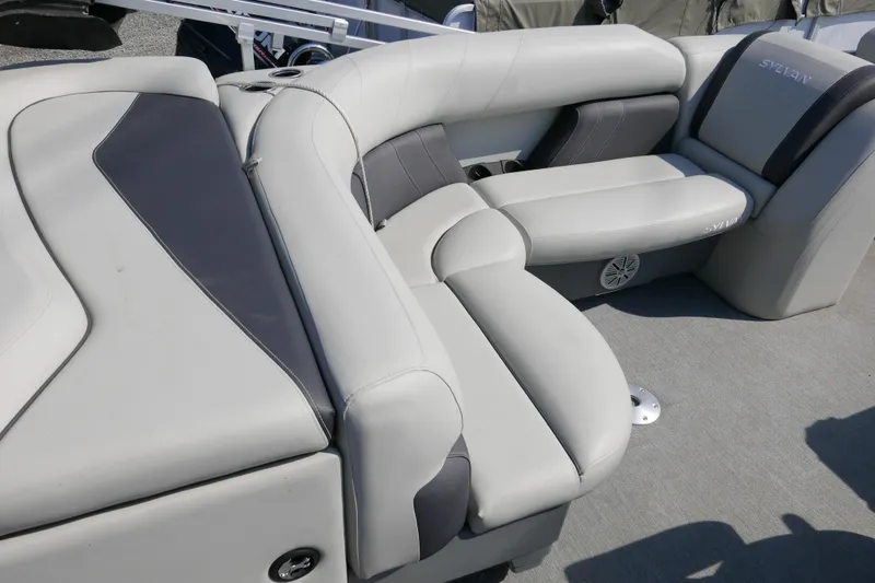 Slide: The Image of Luxurious seating on 2021 Sylvan Mirage 8520 Cruise pontoon boat, featuring plush gray upholstery. - 8