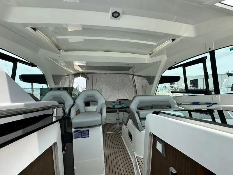 Slide: The Image of Interior of 2021 Beneteau GT 32 yacht, featuring modern seating and sleek design. - 20