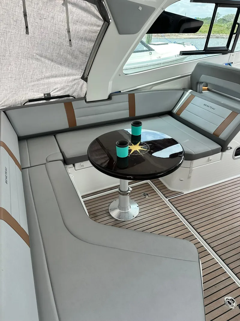 Slide: The Image of 2021 Beneteau GT 32 yacht interior with sleek seating and table. - 24
