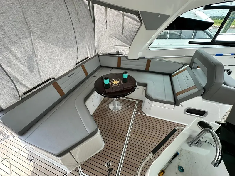Slide: The Image of 2021 Beneteau GT 32 yacht interior with elegant seating and table setup. - 28