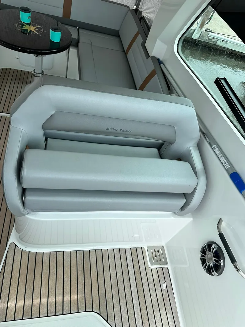 Slide: The Image of Interior of 2021 Beneteau GT 32 yacht with sleek seating and wooden flooring. - 34