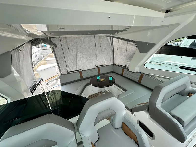 Slide: The Image of Interior of 2021 Beneteau GT 32 yacht with modern seating and table. - 39