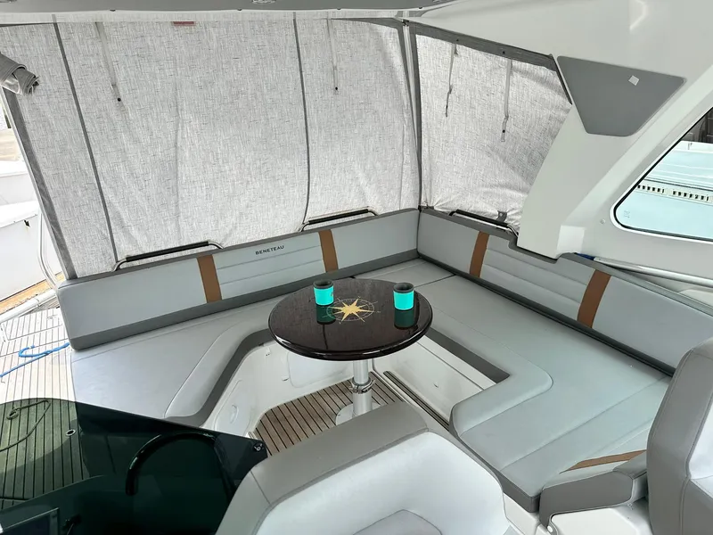 Slide: The Image of 2021 Beneteau GT 32 yacht interior with cozy seating and table. - 42