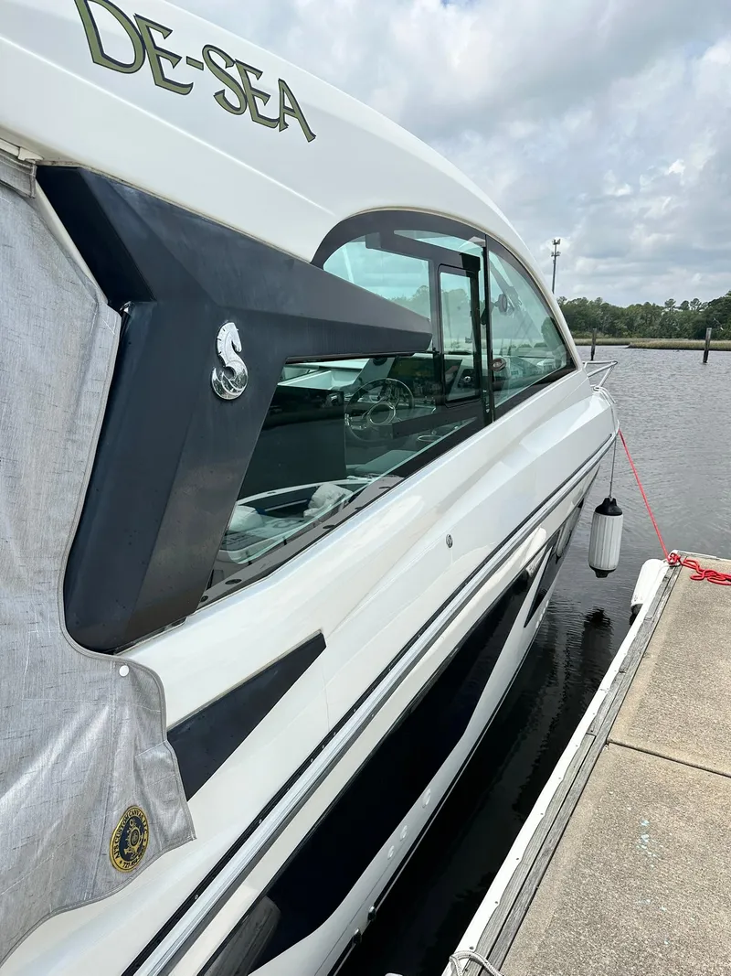 Slide: The Image of 2021 Beneteau GT 32 yacht docked, side view with sleek design and modern features. - 7