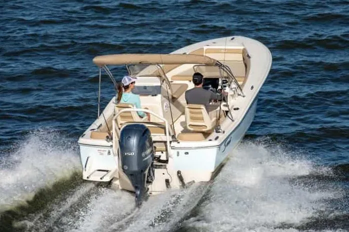 Slide: The Image of Manufacturer Provided Image: 2025 Scout 195 Sport Dorado boat cruising on open water. - 2
