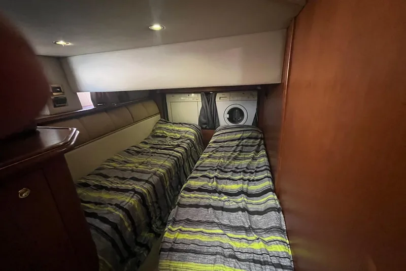 Slide: The Image of Interior of 2000 Cruisers Yachts 5000 Sedan Sport with twin beds and washer-dryer unit. - 11